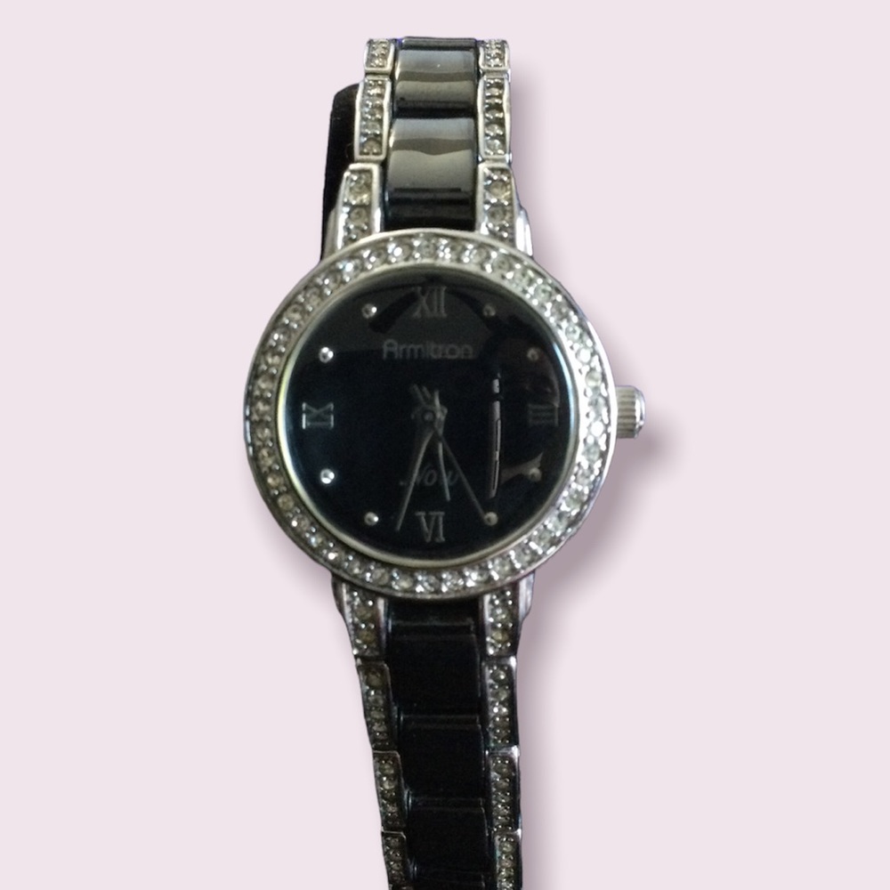 Gun metal watch with beveled diamond watch face
